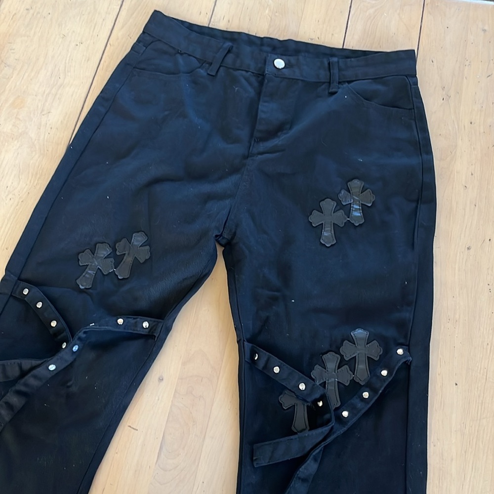 NWOT Stylish Black Flared Jeans with Roman Cross Accents